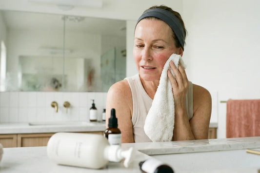 A woman washing her face with cleanser