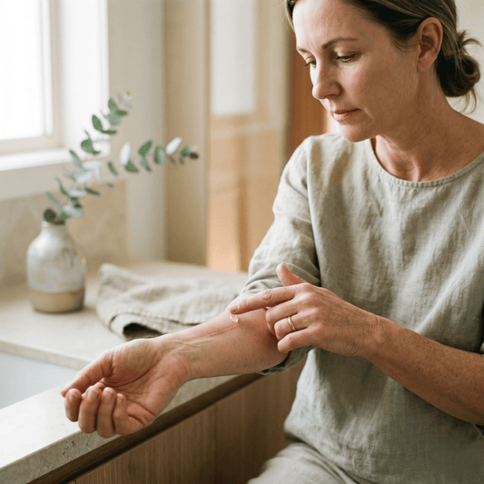 Woman applying silicone scar gel to a healed scar on her arm, a daily step to help fade and soften the scar