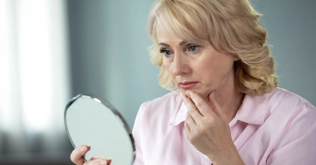 Mature woman showing common signs of menopausal skin changes