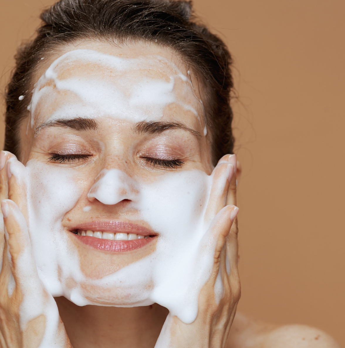 A woman washing her face