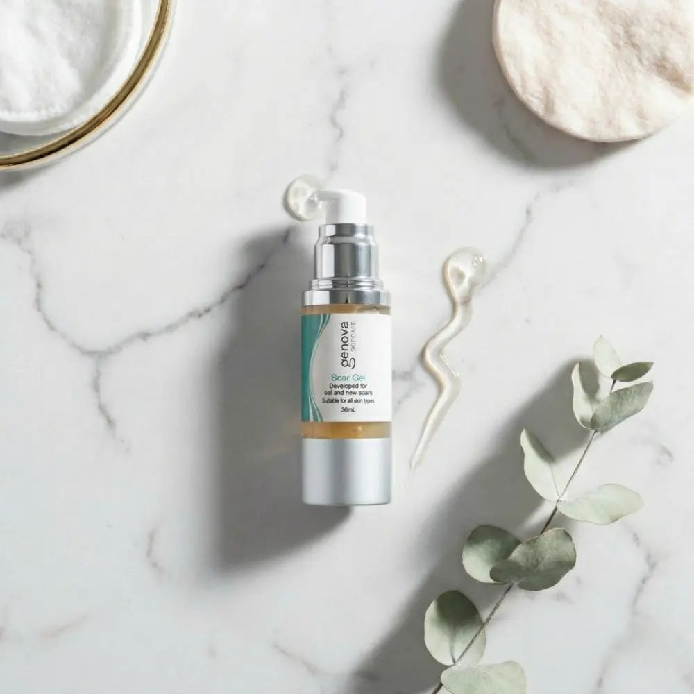 Genova Silicone Scar Gel bottle on white marble surface with clear gel texture and eucalyptus, flat lay skincare editorial