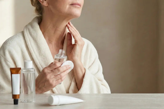 A woman trying different skincare products on her neck
