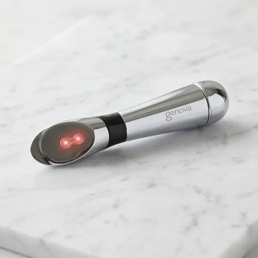 Genova Ion Applicator galvanic skincare device with red LED light on marble surface, helps improve serum absorption for menopausal skin