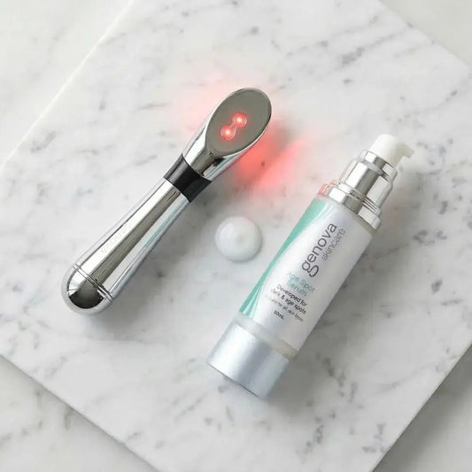 Genova Ion Applicator paired with Age Spot Serum on marble, galvanic device designed to boost active ingredient absorption into menopausal skin