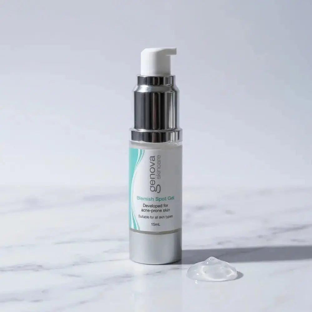 Genova Skincare Blemish Spot Gel 15mL pump bottle for acne prone skin on marble surface with clear gel texture swatch