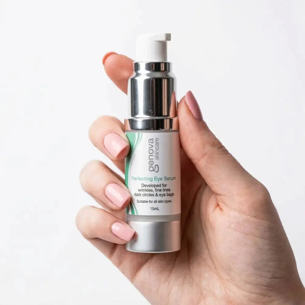 Hand holding Genova Perfecting Eye Serum 15ml showing compact pump bottle size, eye serum for wrinkles, fine lines and dark circles